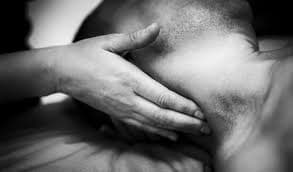 A person experiencing neck and shoulder pain